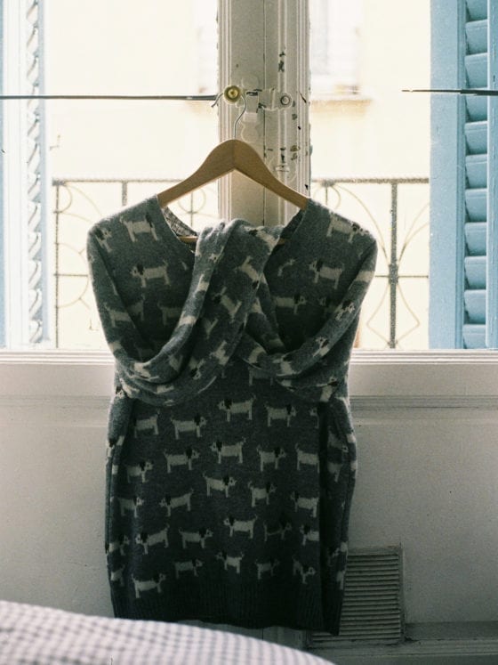 A dress on a hanger by a window