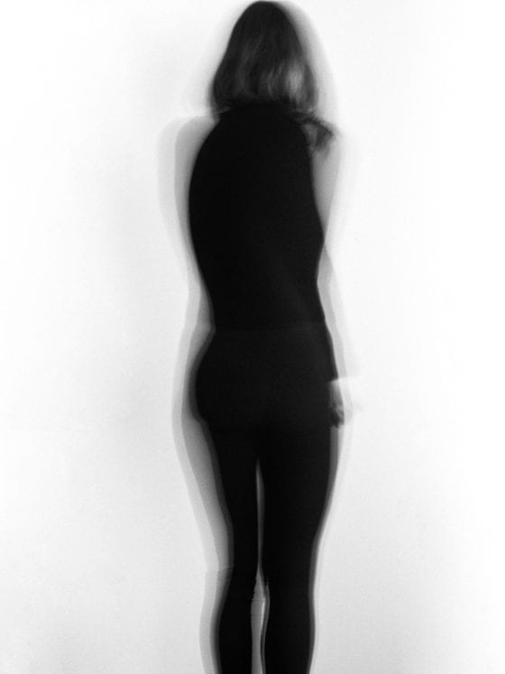 A blurry image of the figure of a woman