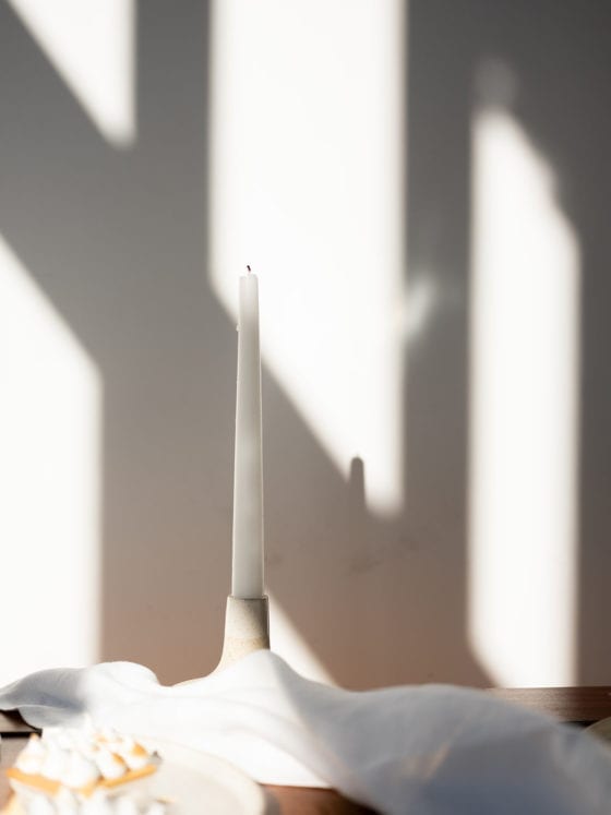 A candle on a table