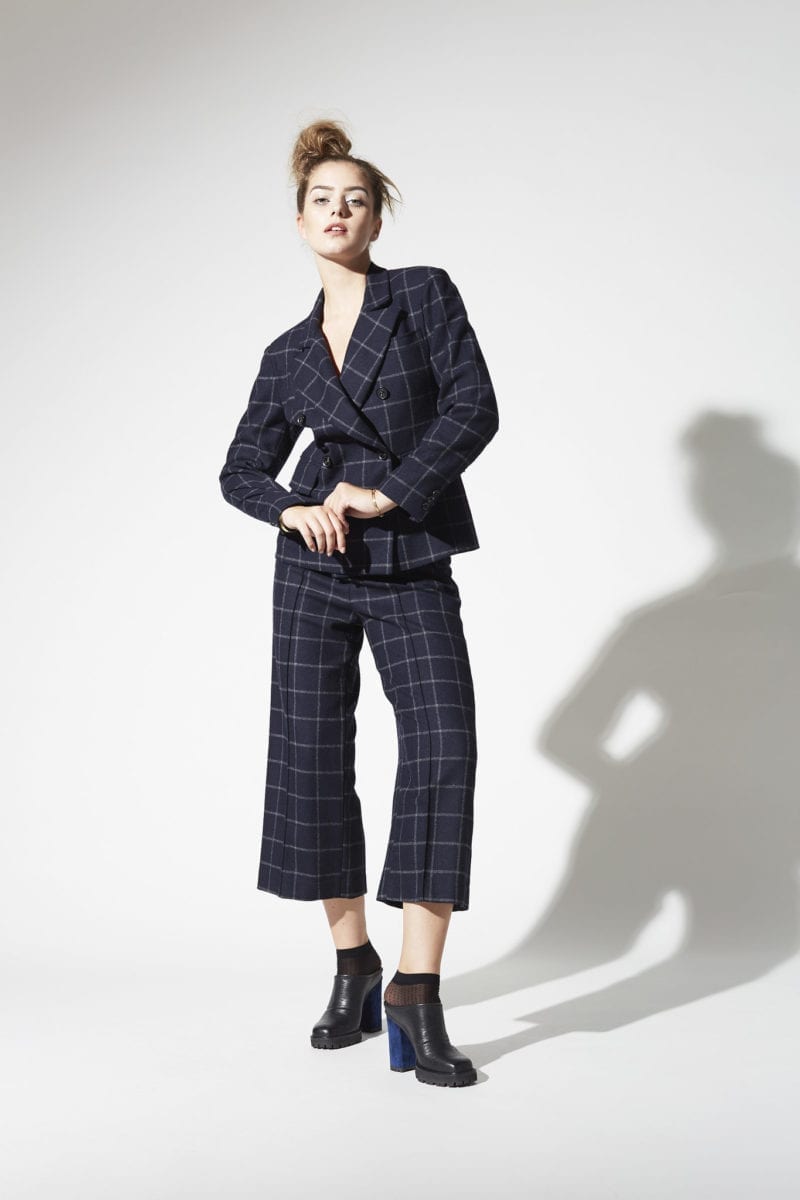 A woman in a plaid suit outfit