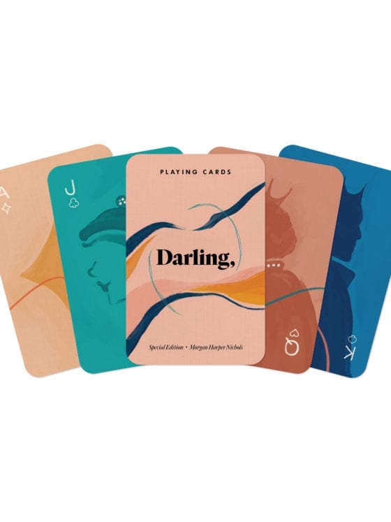 Five playing cards fanned out to see the art on the back of each