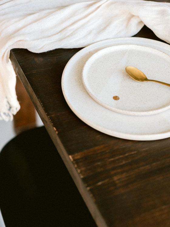 A picture of an empty plate at a dining table