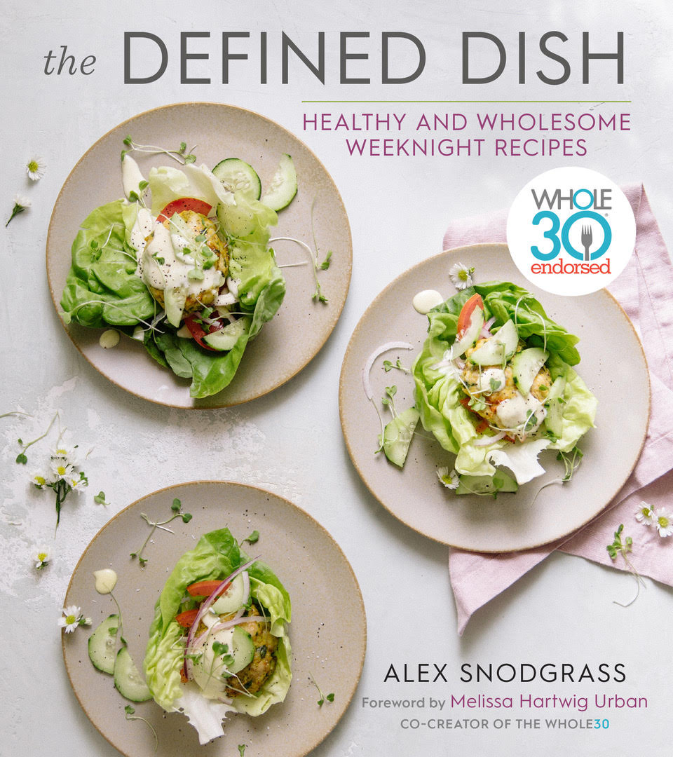 The book cover of "The Defined Dish" cookbook