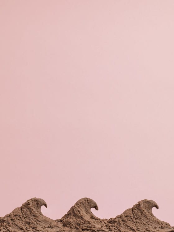 A photo of chocolate ice cream set to a pink background