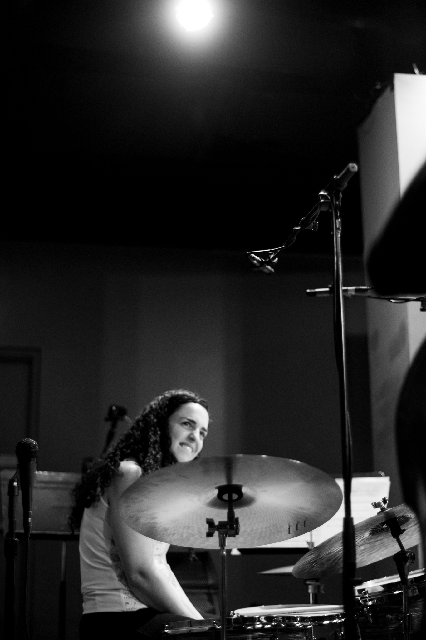 A young woman playing the drums