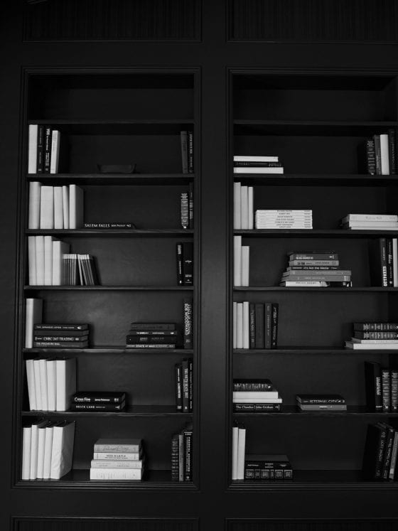 A black and white image of a bookcase