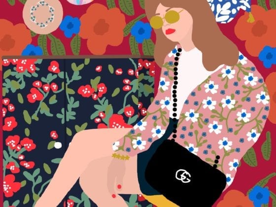 An illustration of a young woman seated on her sofa wearing shades and a designer bag