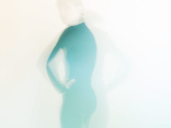 An image of a blurred silhouette of a woman