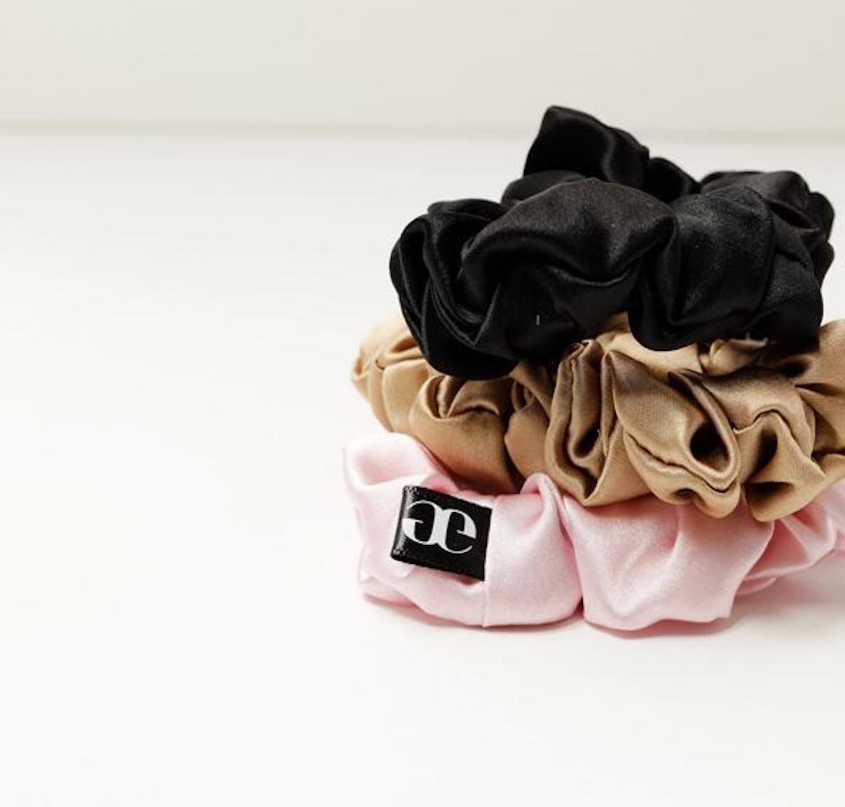 A stack of multi-color hair scrunchies