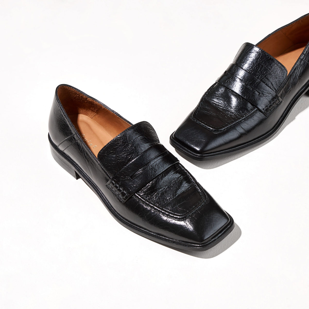 A pair of black leather loafers
