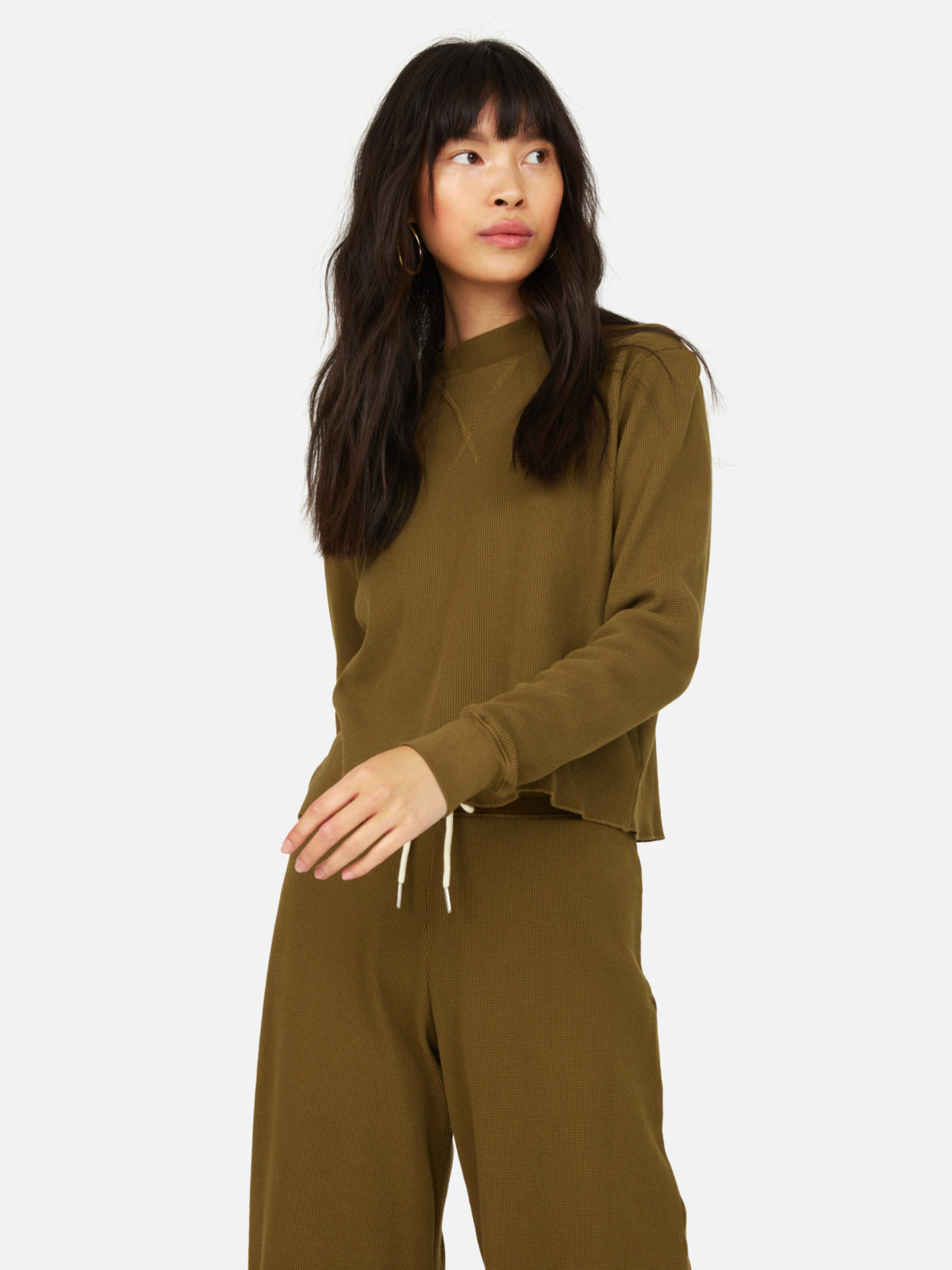 A woman in a green fleece set