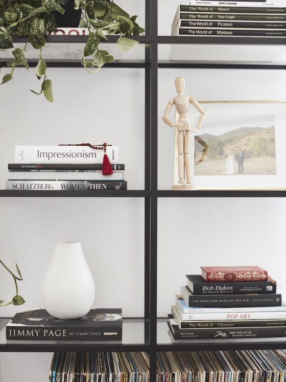 A bookshelf with books and magazines