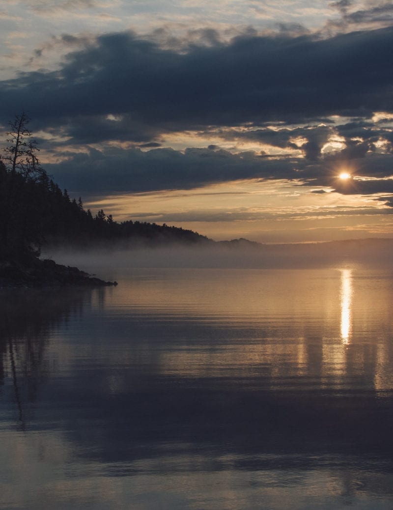 A sunrise over a lake