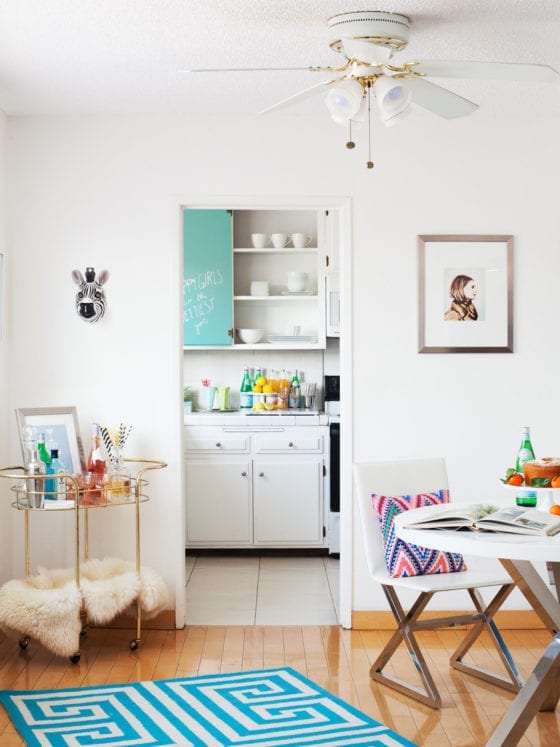 A photo of a living room entryway into a kitchen