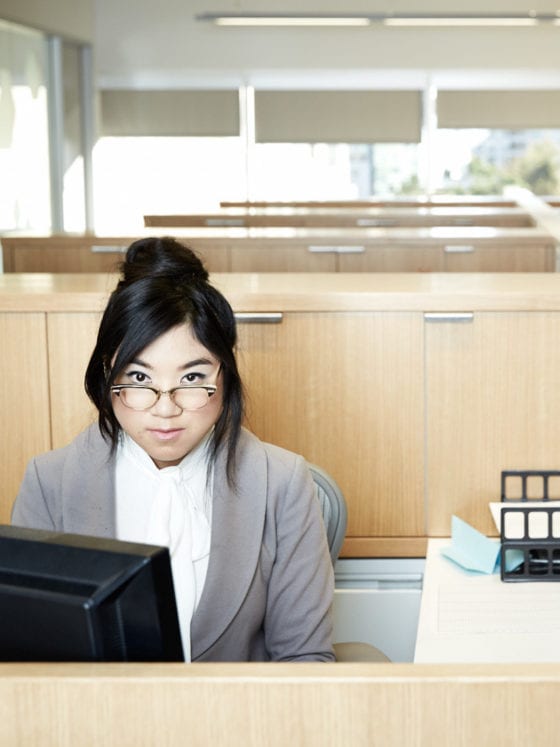 A woman seated at an office desk