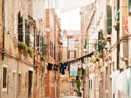 A narrow road between buildings in Italy