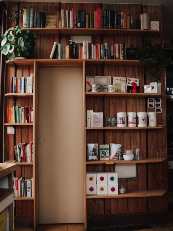 A bookshelf against a wall